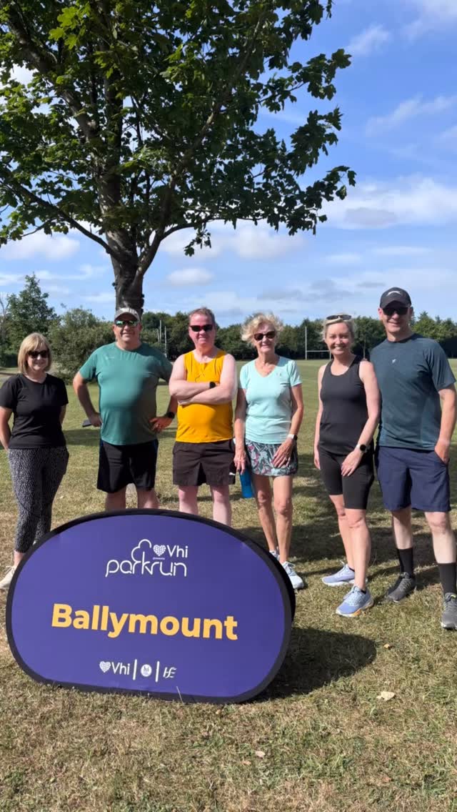 Group standing outdoors at a Vhi parkrun Ballymount community event